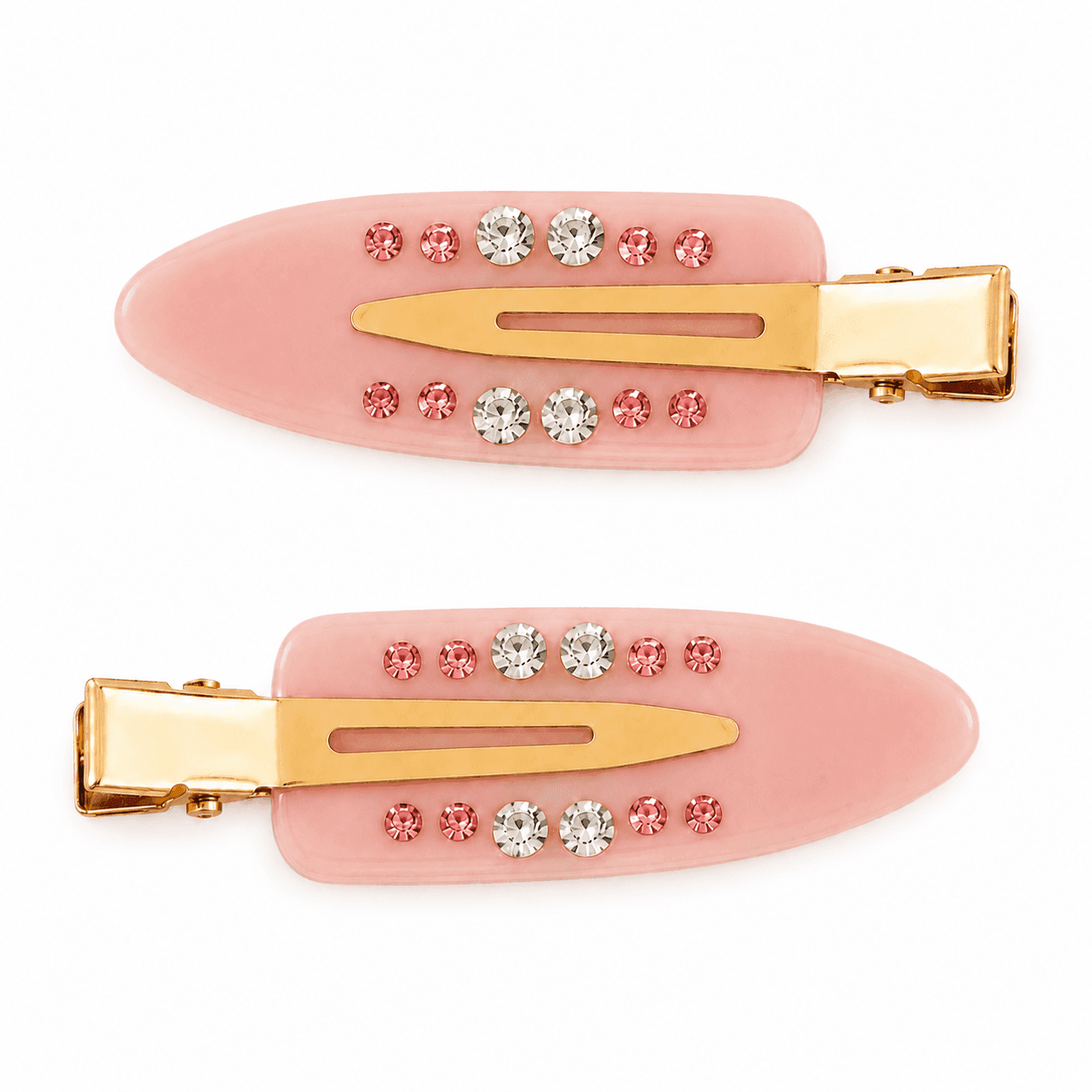 A pair of soft pink Blush Confetti pintail clips with gold hardware and rows of pink and clear stones.