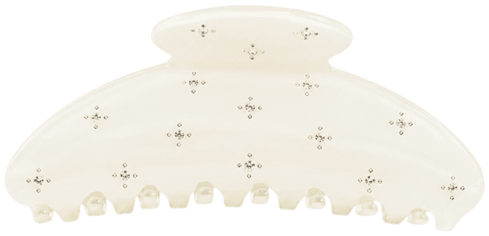 The Champagne claw clip in marbled ivory, scattered with clear stones, straight on from the front.