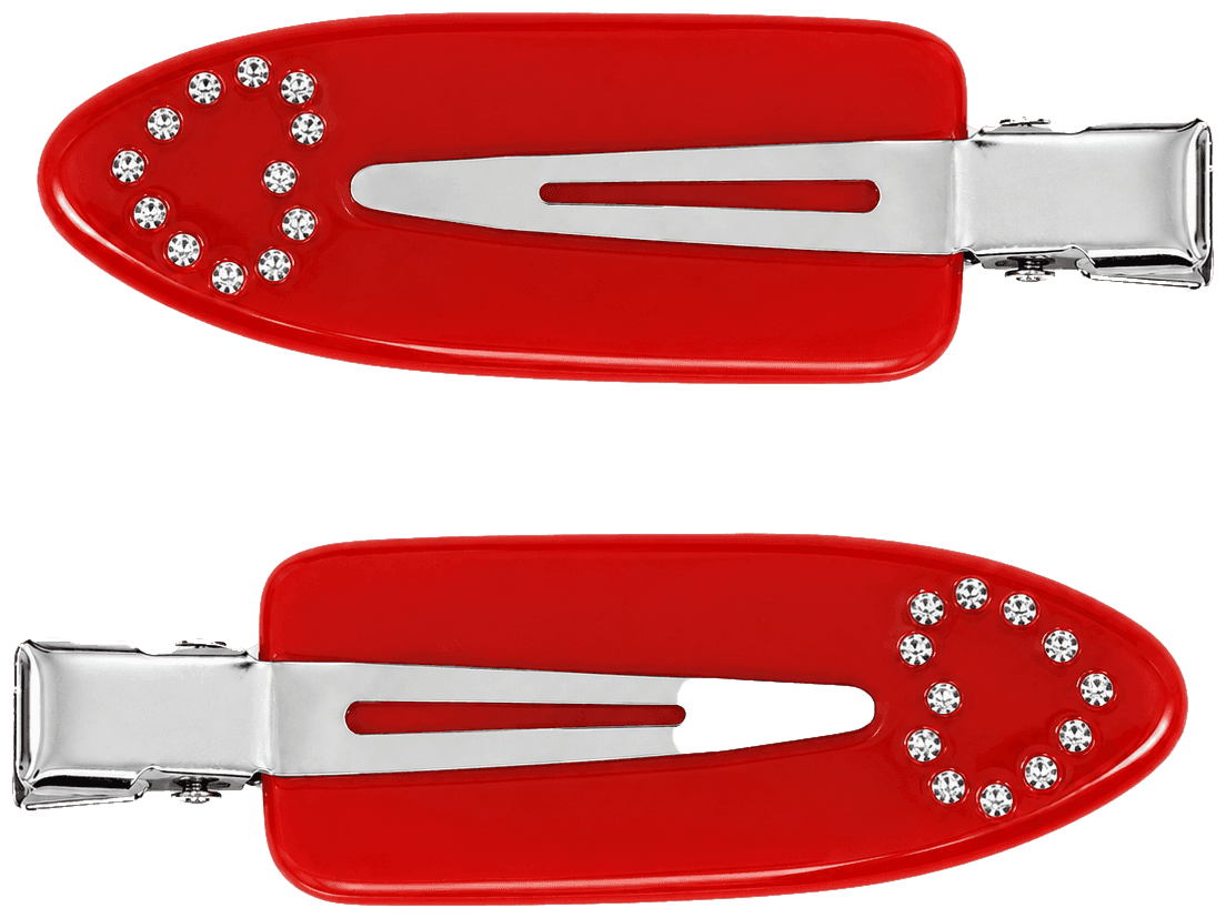 A pair of red Cherry pintail clips with silver hardware and a ring of clear stones.