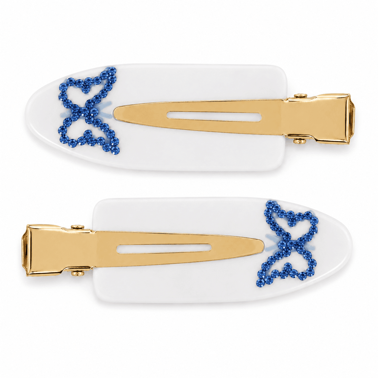 A pair of white Cornflower pintail clips with a bow outlined in blue stones.