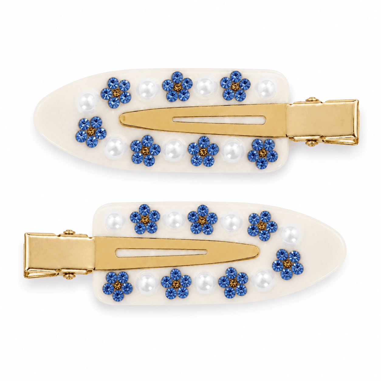 A pair of ivory Daisy pintail clips with blue flowers and round white beads.